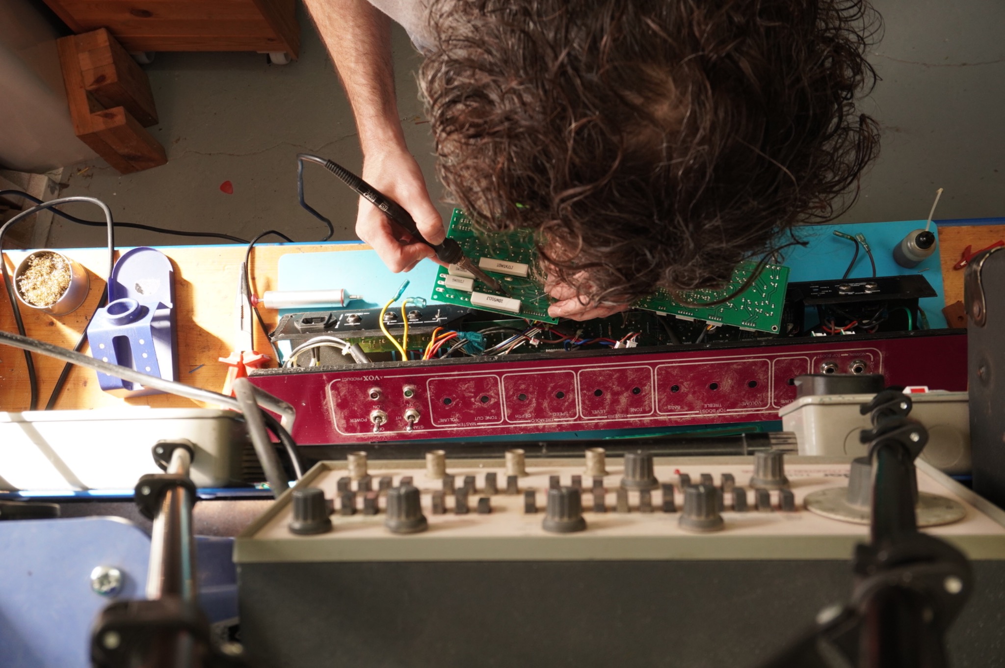 Soldering work on the raised Vox AC30 circuit board during repair